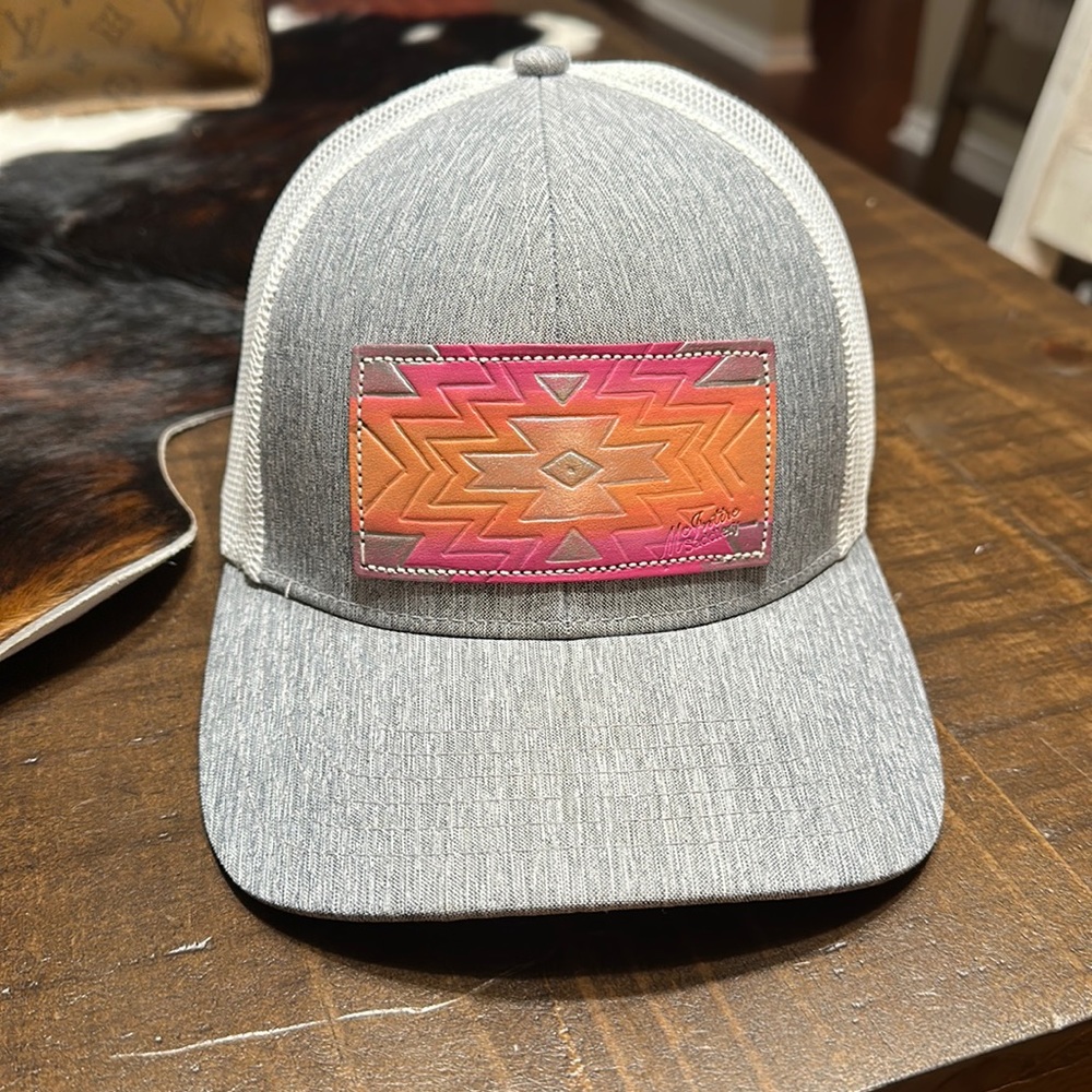 Leather tooled patch trucker hat
